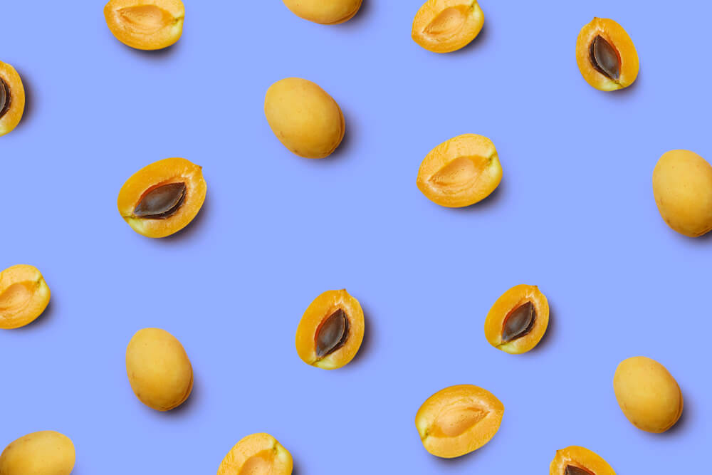 fresh-apricots-on-a-periwinkle-background