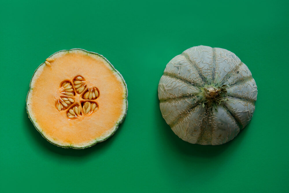 fresh-cantaloupe-on-a-bright-green-background-1-