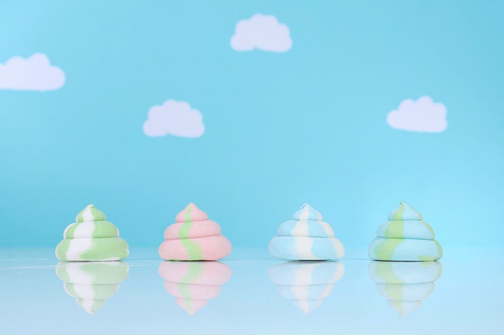 colorful-marshmallow-poop-in-front-of-a-blue-sky-background